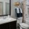 a bathroom with a sink toilet and mirror