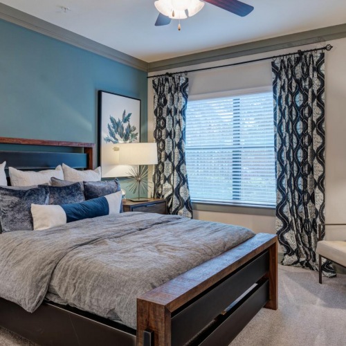 Beautiful bedrooms to fit every need a bedroom with a bed and a fan